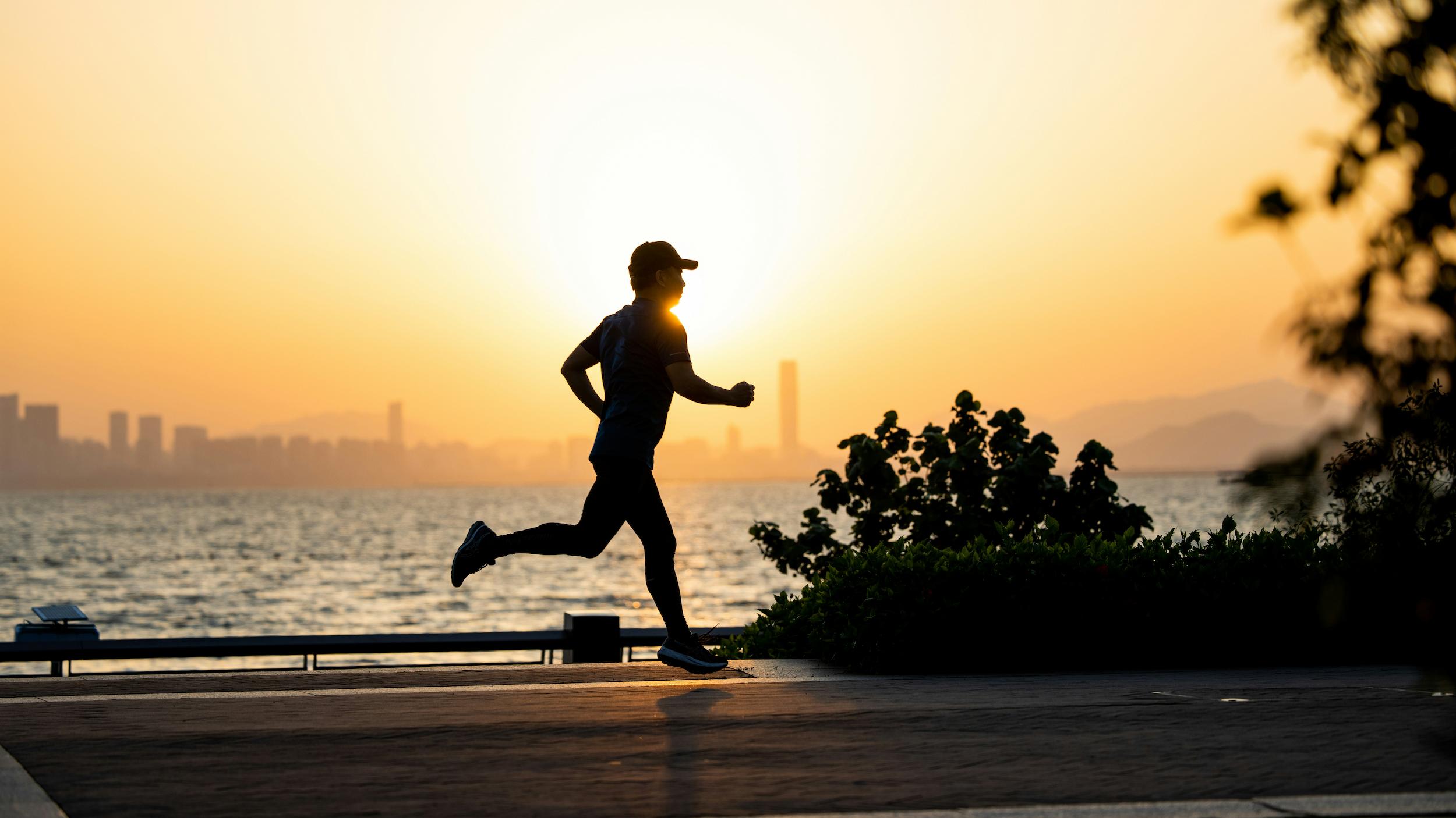 Person jogging outdoors in natural surroundings representing exercise benefits