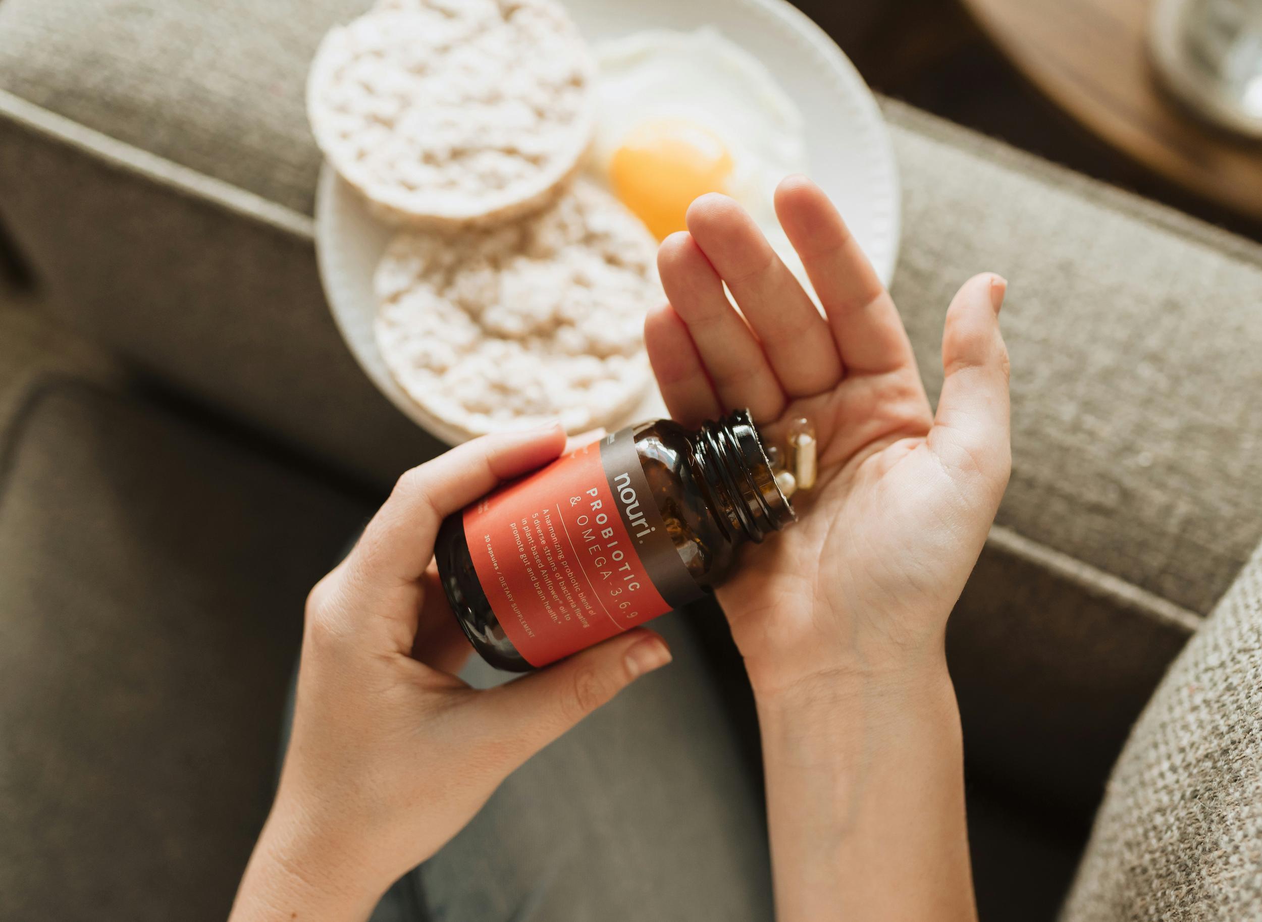 Selection of probiotic supplement capsules and natural probiotic foods
