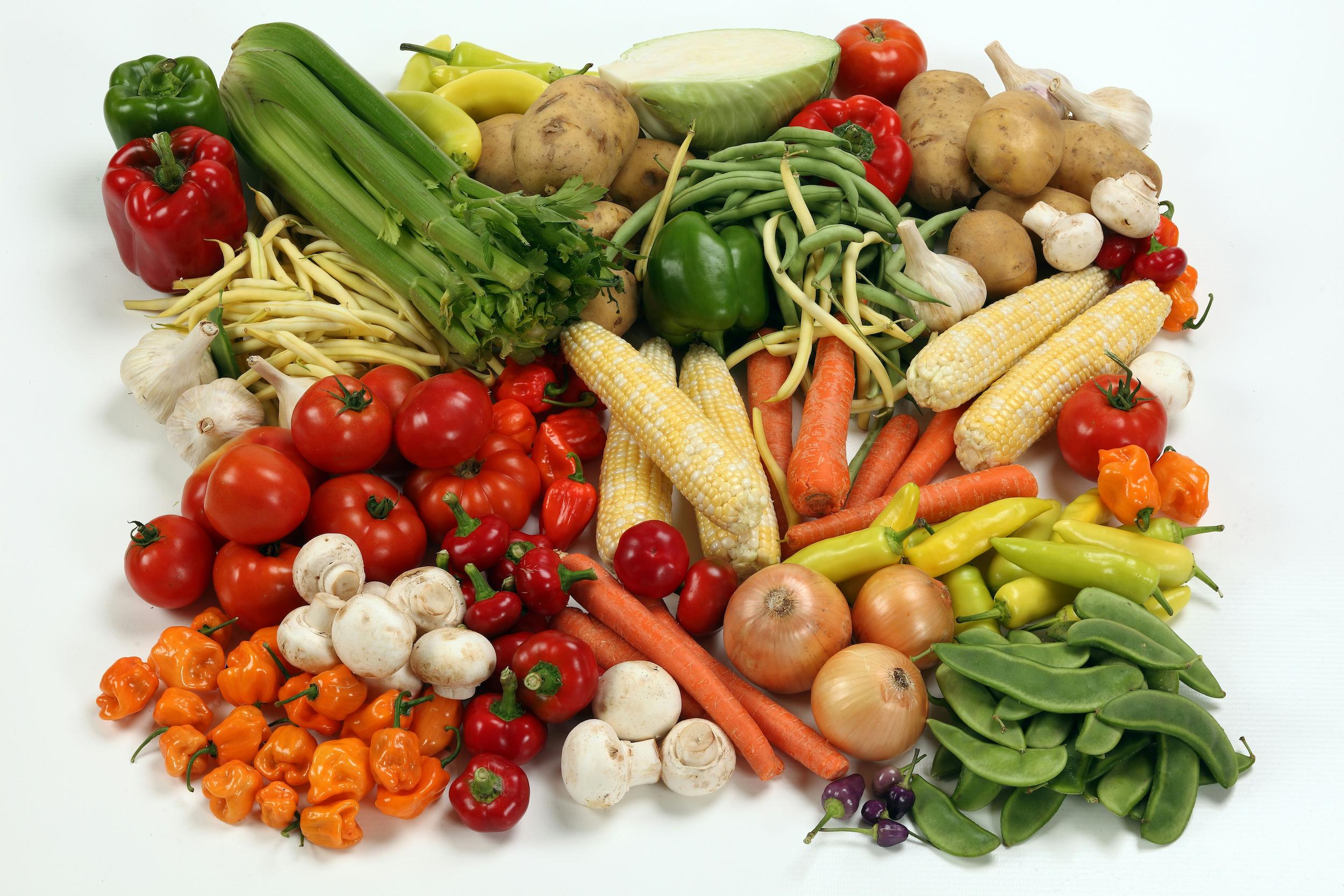 Colourful, fibre-rich vegetables and fermented foods arranged on a wooden board